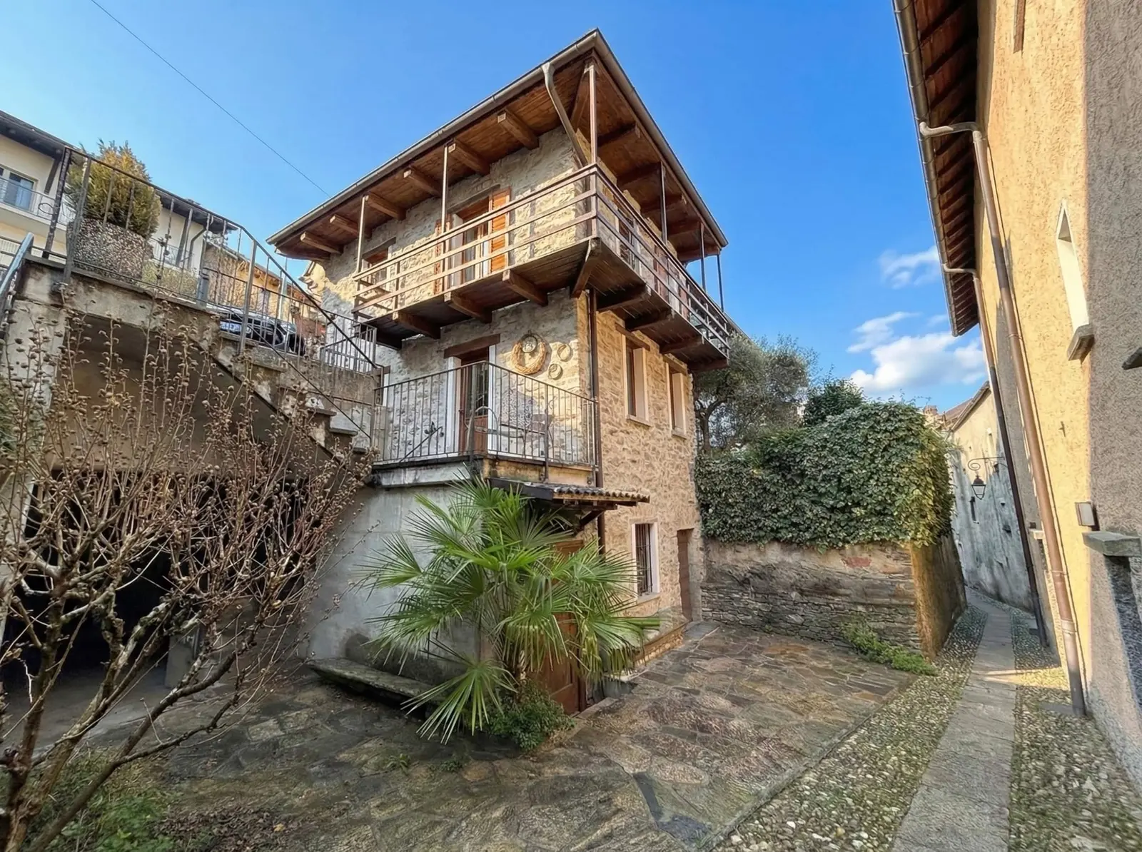 Traditional stone house and courtyard in Brione sopra Minusio