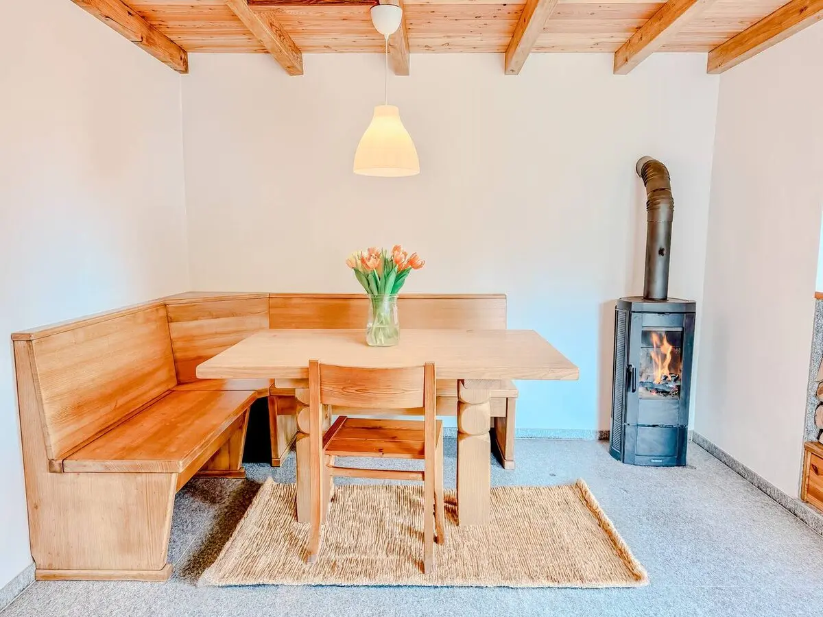 Dining nook and wood stove in the Monti Motti cabin