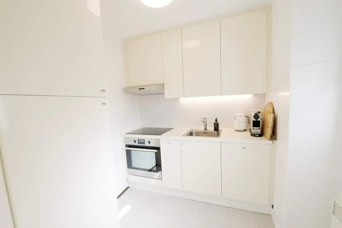 White kitchen in the Vira village home